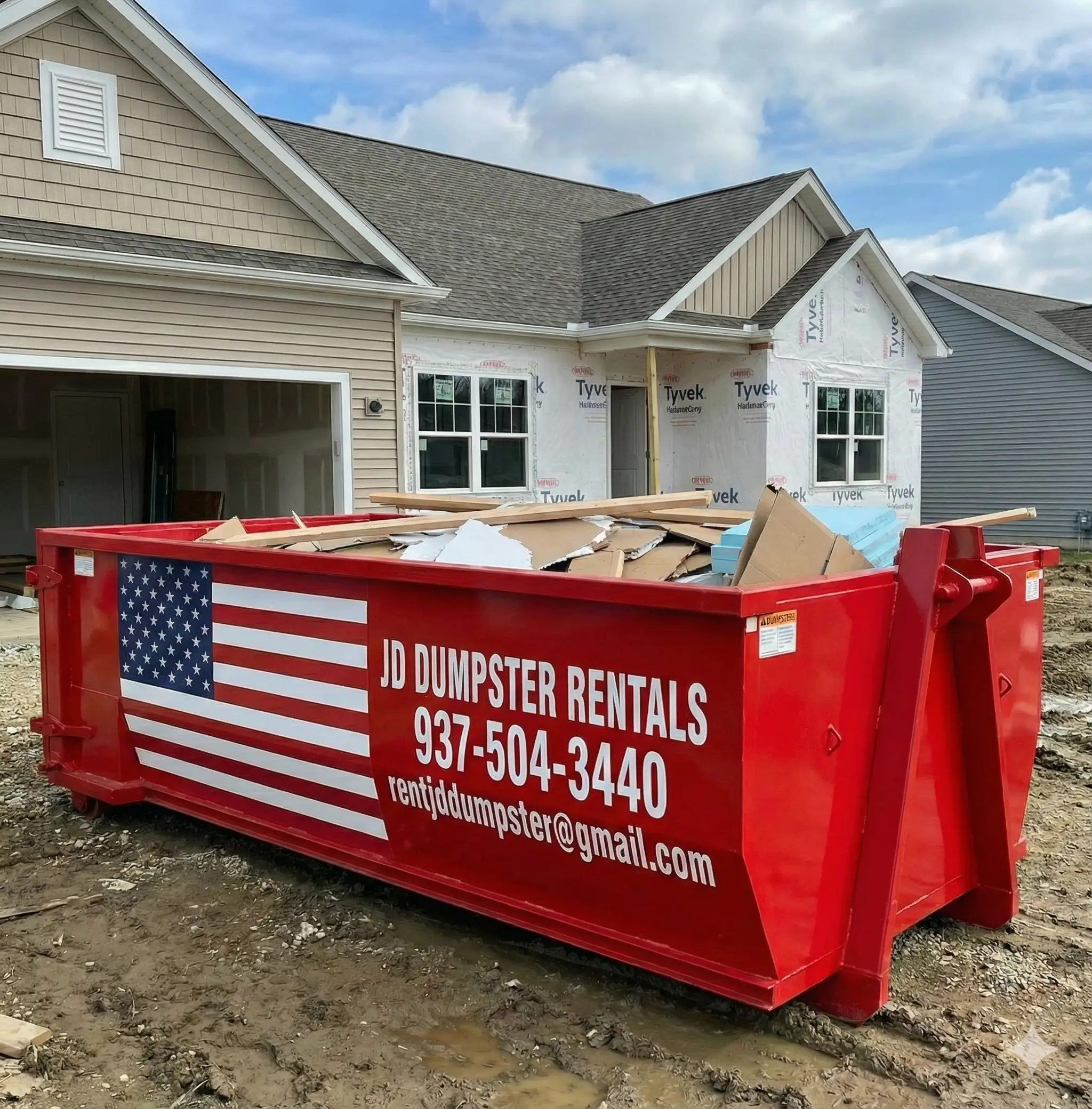 JD Dumpster Rentals red roll off dumpster at a construction site in London Ohio