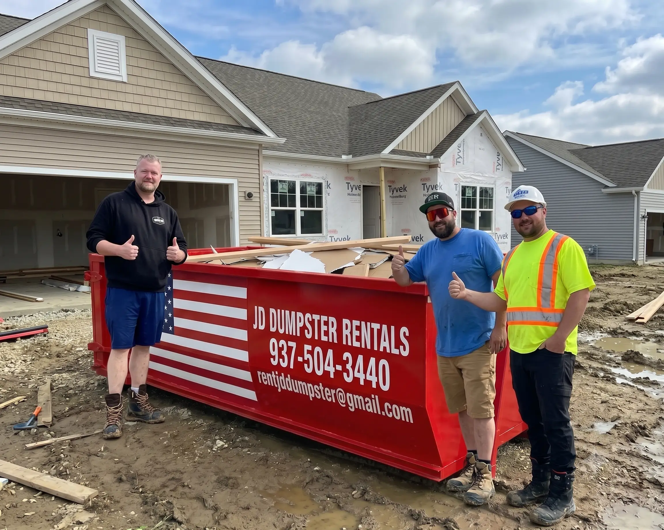 JD Dumpster Rentals red roll off dumpster on site in Central Ohio